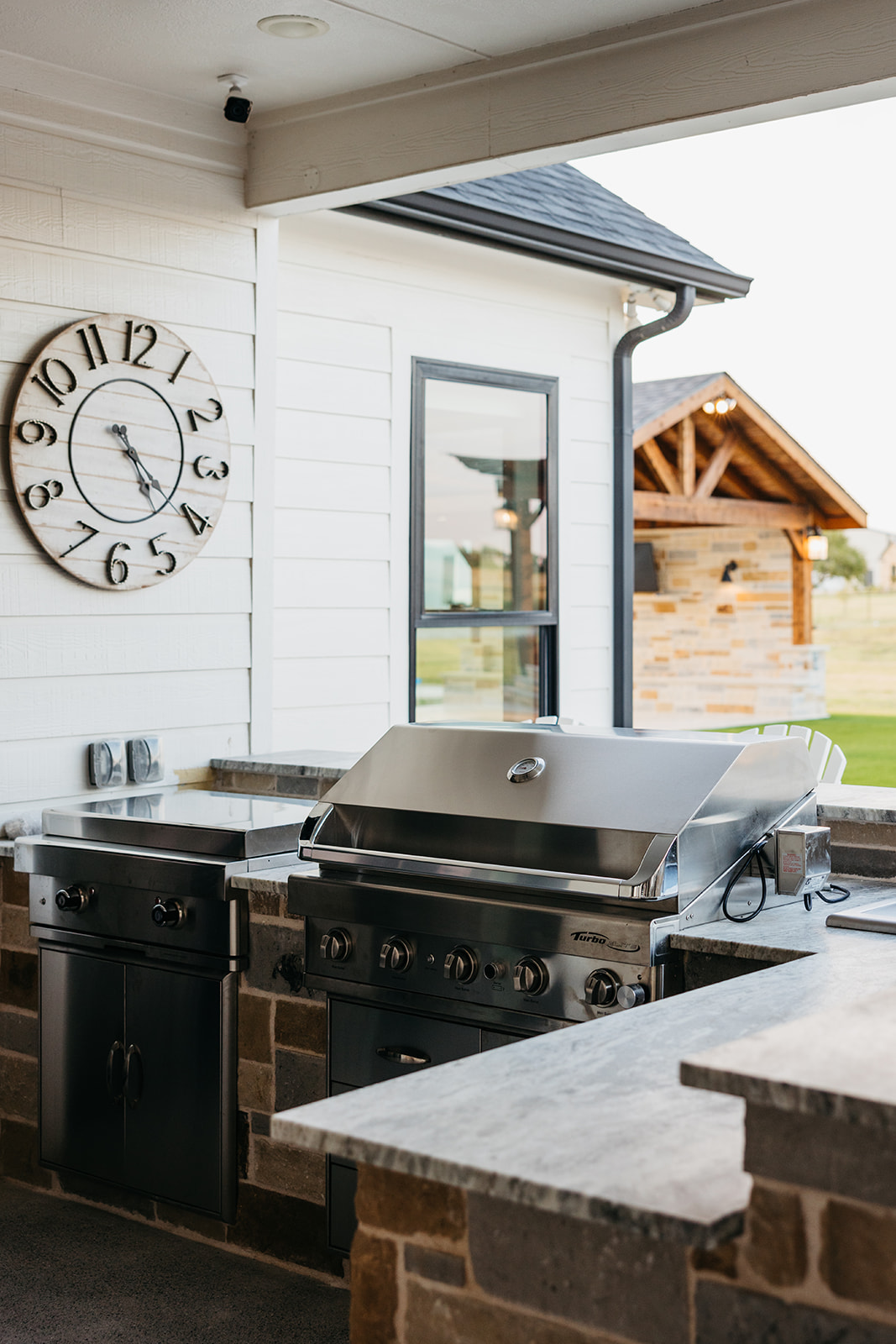 Rustic Outdoor Kitchen with Wood-Fired Pizza Oven