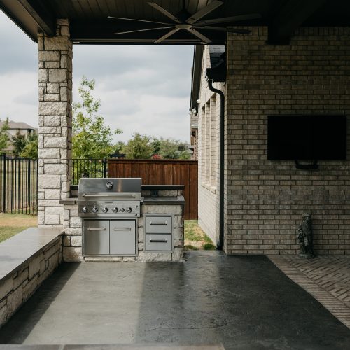 Backyard Outdoor Kitchen with Stainless Steel Appliances