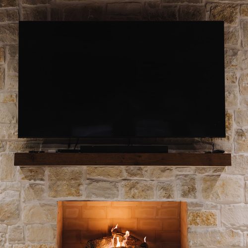 Stone Outdoor Fireplace with TV in Gunter TX